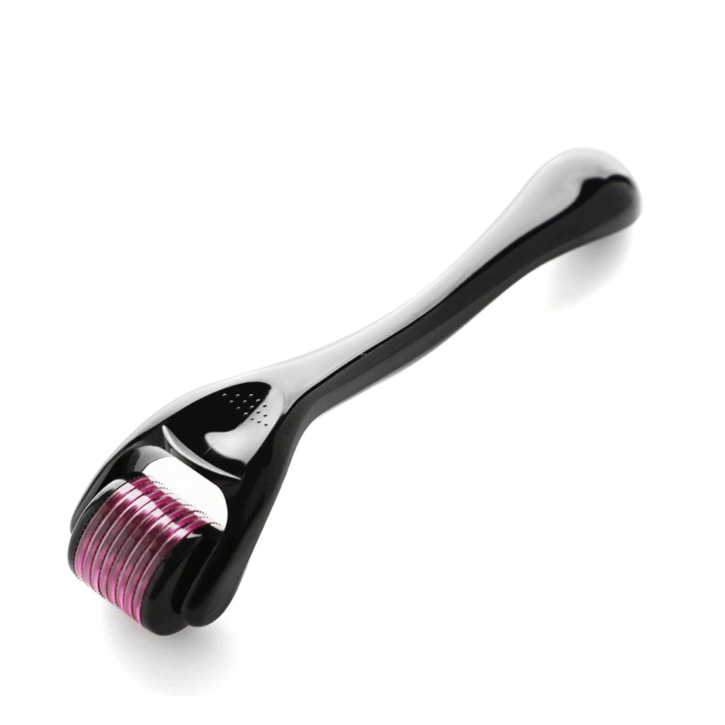 Black derma roller with pink micro-needles for hair and scalp care on white background