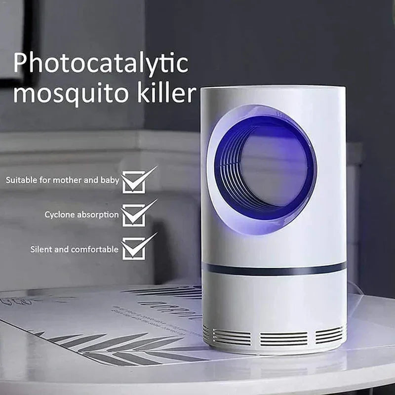 Photocatalytic mosquito killer device with blue light on tabletop, features cyclone absorption.